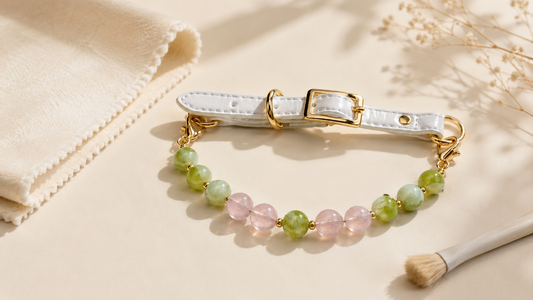 Beaded dog collar beside a soft cleaning cloth for gentle decorative collar care