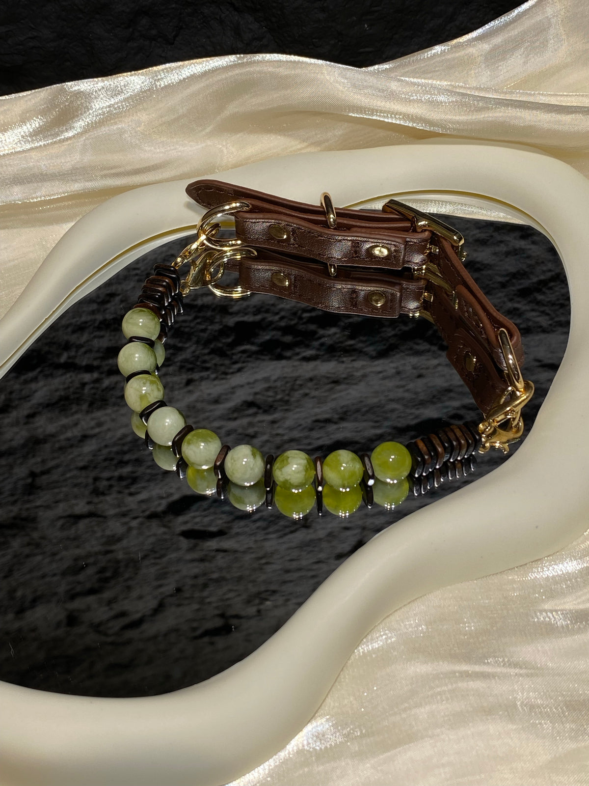 Forest Green Vintage crystal pet collar with marbled green beads and brown strap styled on cream satin