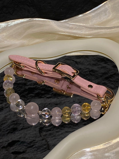 Peach Glow crystal pet collar with blush pink, warm yellow and clear beads styled on cream satin