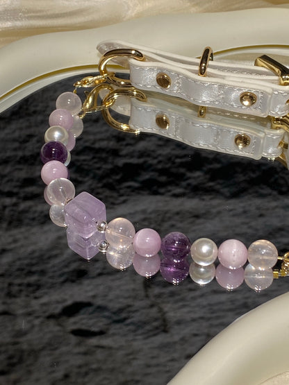 Taro Purple crystal pet collar with lavender beads and white strap styled on cream satin