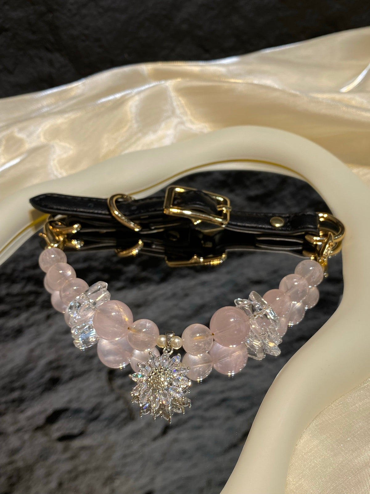 Blush Snowflake crystal pet collar with pale pink beads and sparkling snowflake charm styled on cream satin