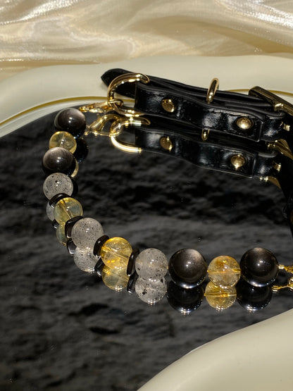 Close-up of black, gray and warm yellow beads on Midnight Gold crystal pet collar