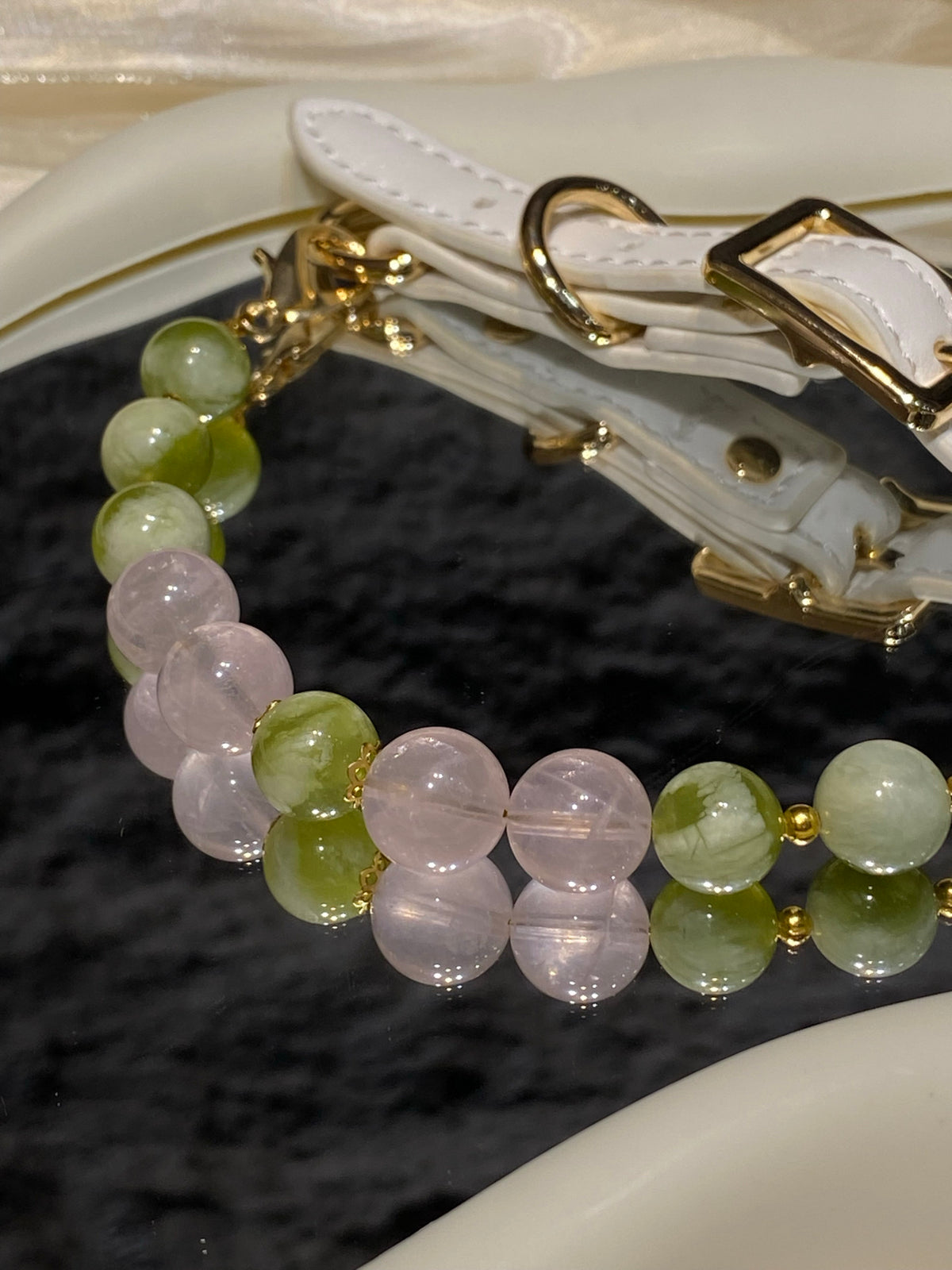 Close-up of blush pink and green beads on Green Mist & Peach crystal pet collar