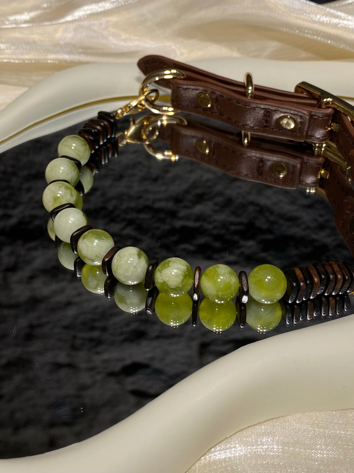Close-up of marbled green beads and dark brown spacers on Forest Green Vintage crystal pet collar