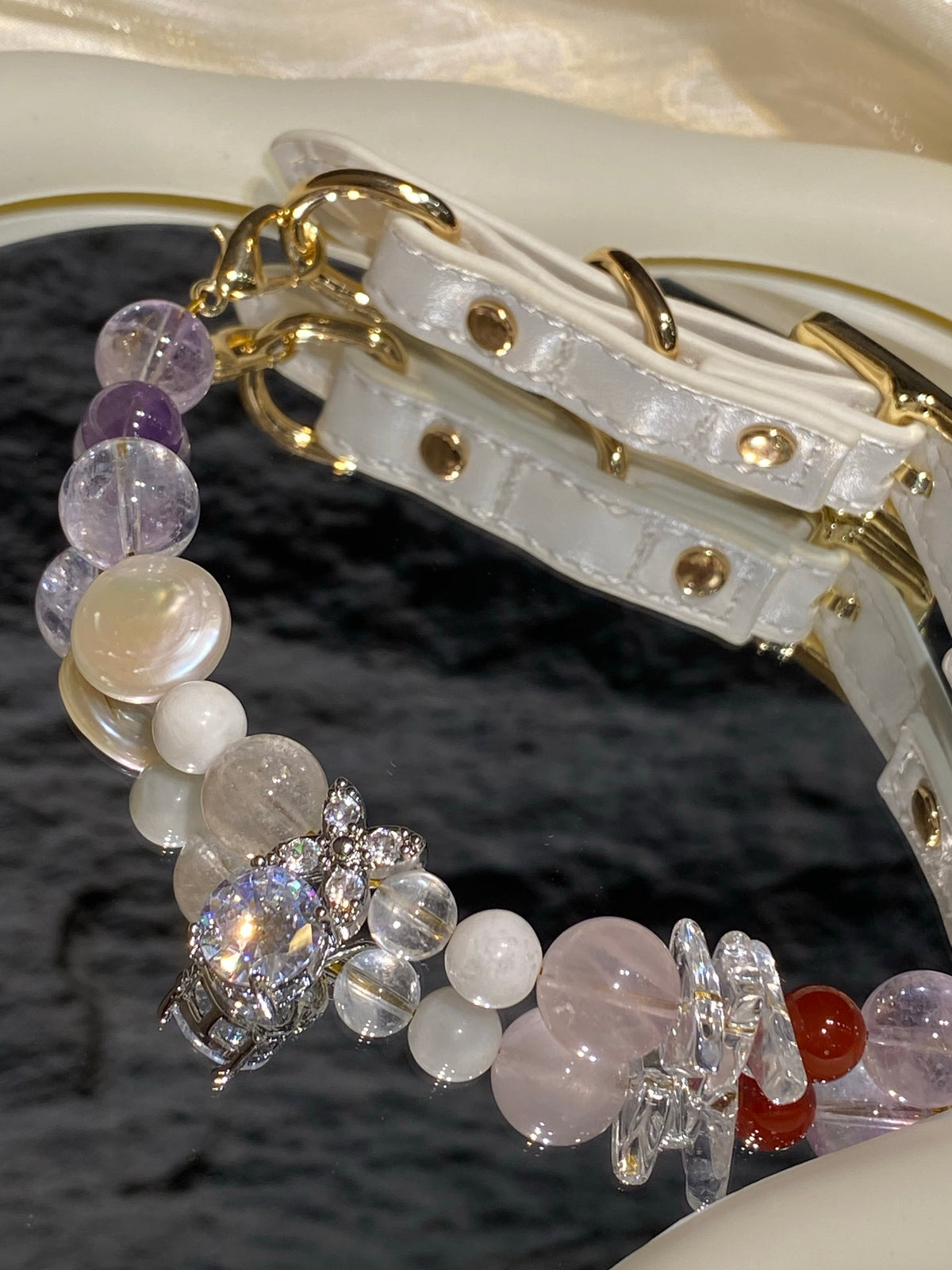 Close-up of pastel beads and silver-tone sparkling charm on Lavender Charm crystal pet collar