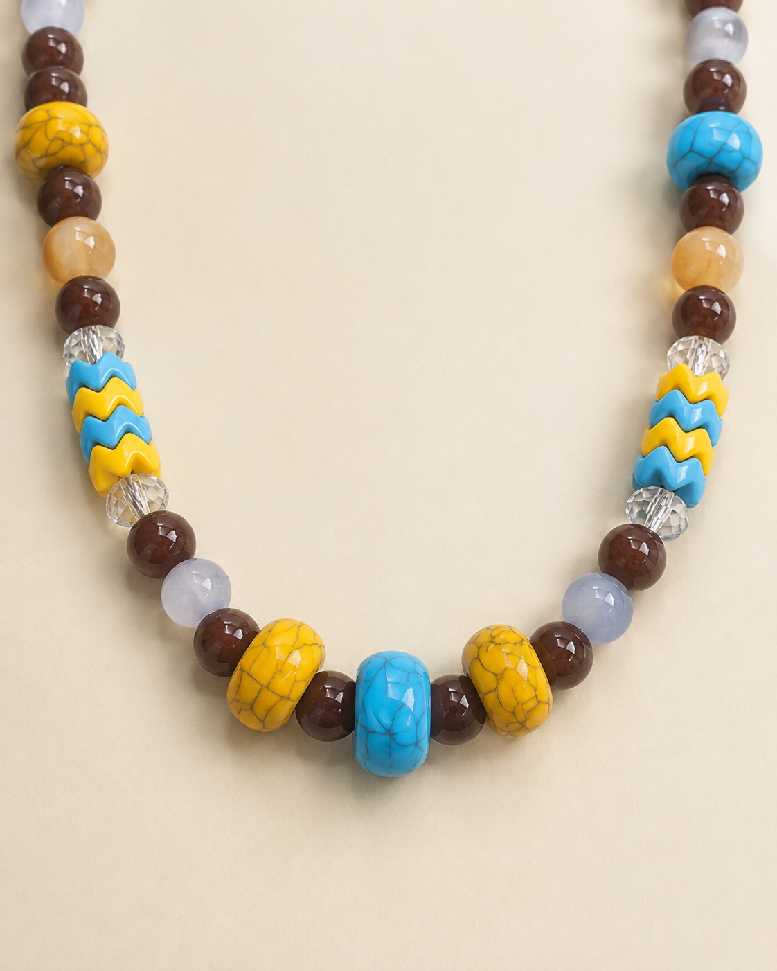 Close-up of blue yellow wave beads and crackle beads on pet necklace