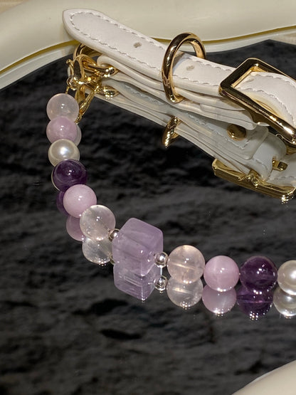 Close-up of lavender, purple, clear and pearl-like beads on Taro Purple crystal pet collar