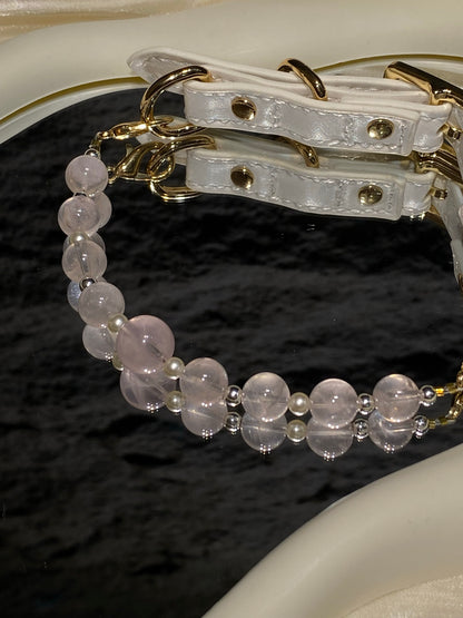 Close-up of translucent blush pink and pearl-like beads on Peach Blush crystal pet collar