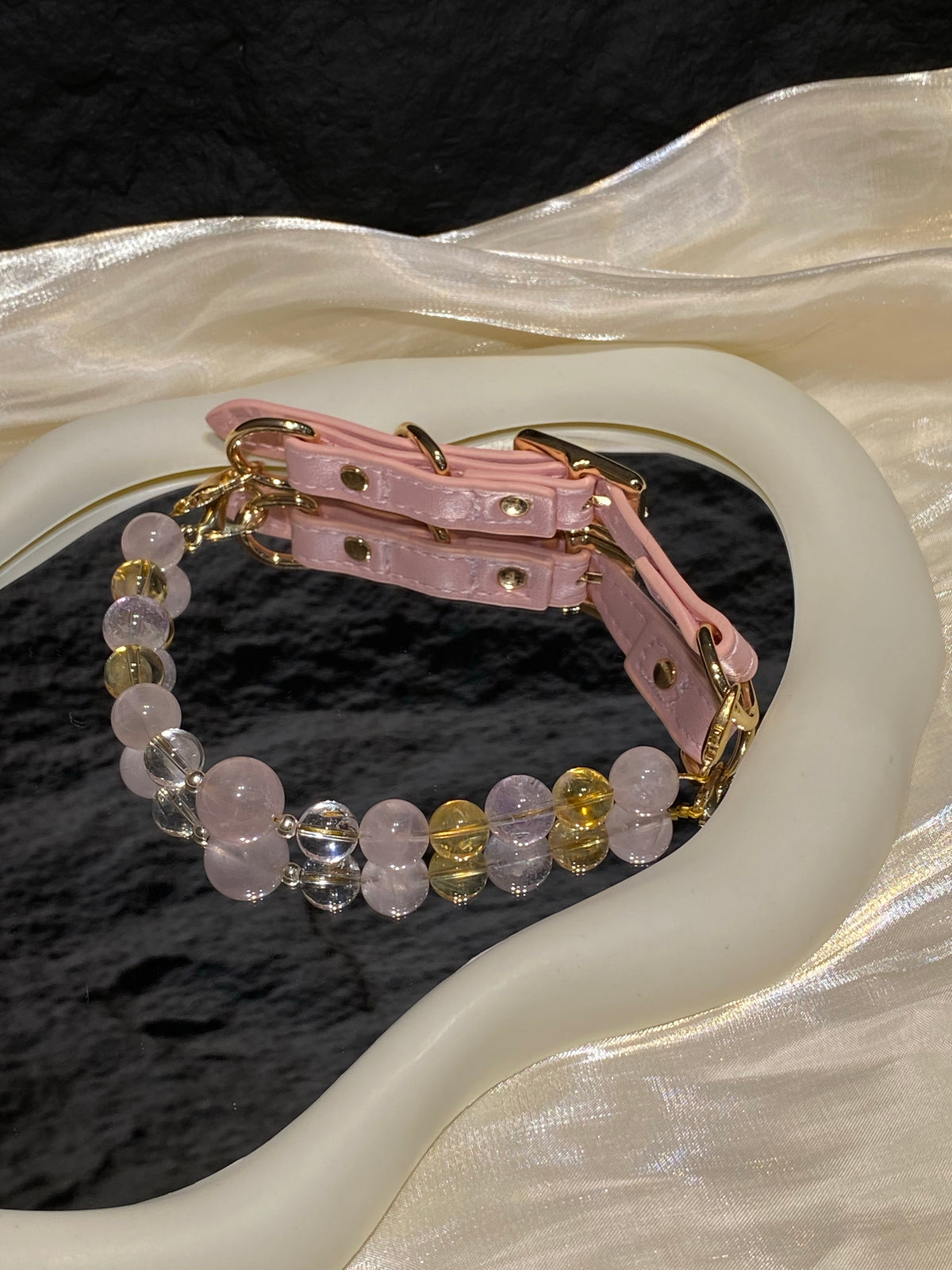 Close-up of blush pink, clear, pale lavender and warm yellow beads on Peach Glow crystal pet collar