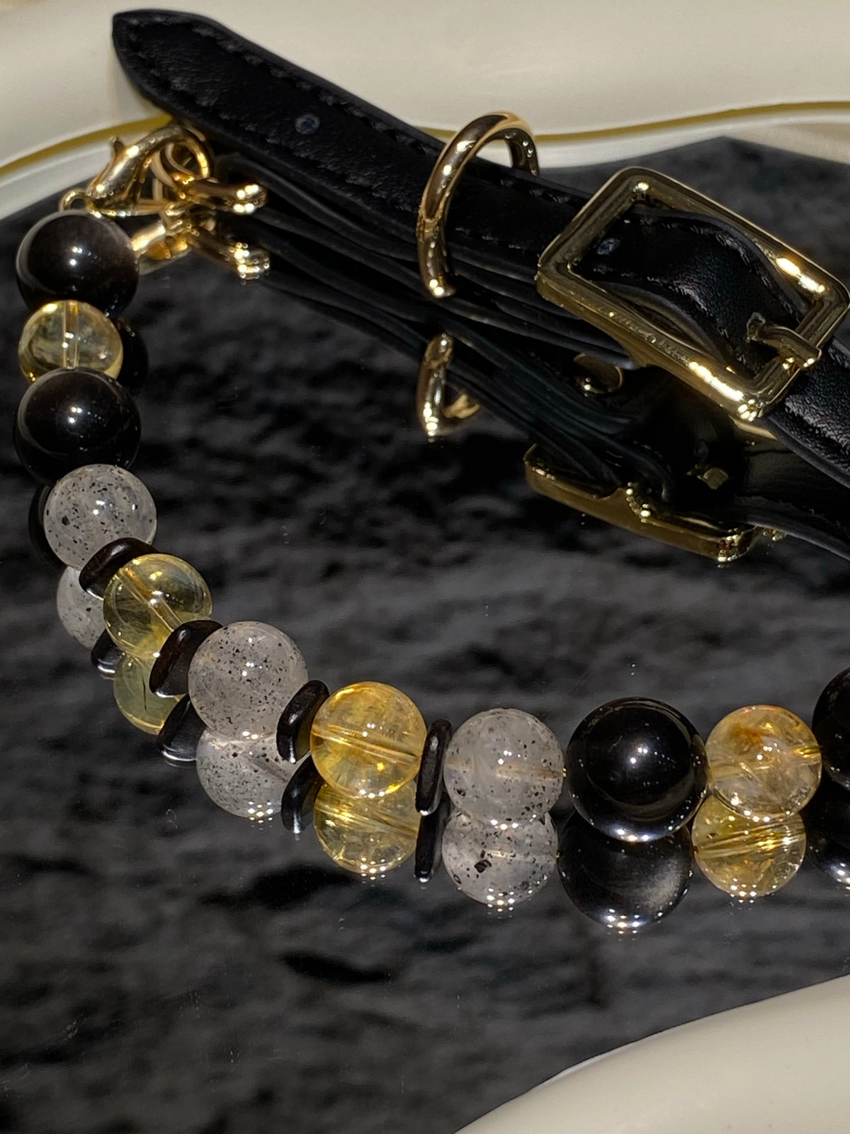 Black strap and gold-tone buckle detail on Midnight Gold mixed-bead crystal pet collar