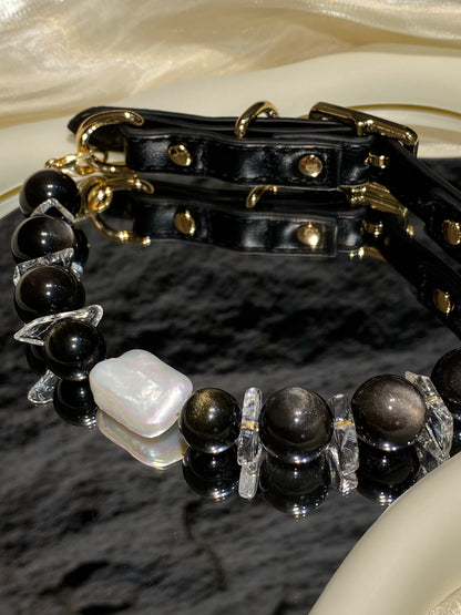 Close-up of dark beads and baroque pearl centerpiece on the Midnight Baroque pet collar