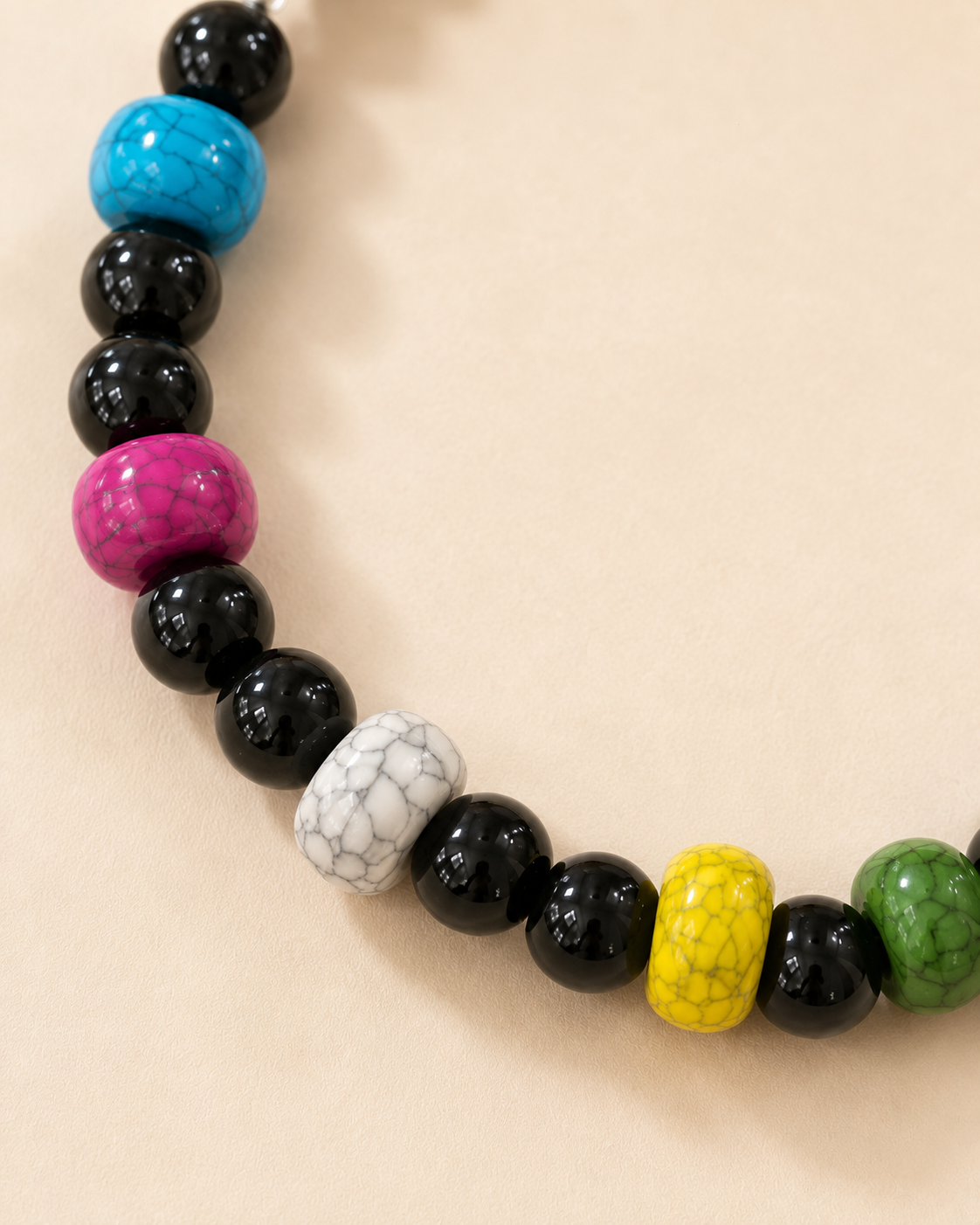 Close-up of colorful marbled accent beads on Color Pop pet necklace