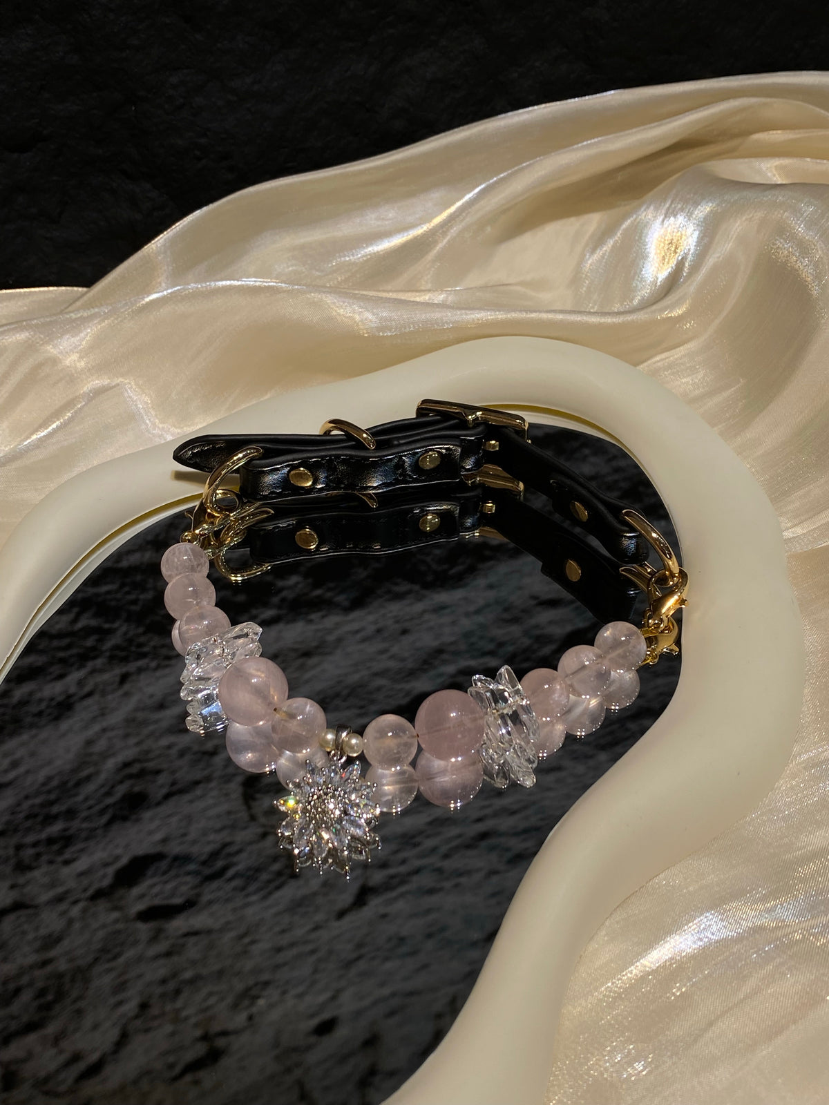 Close-up of clear decorative accents and pink beads on Blush Snowflake crystal pet collar