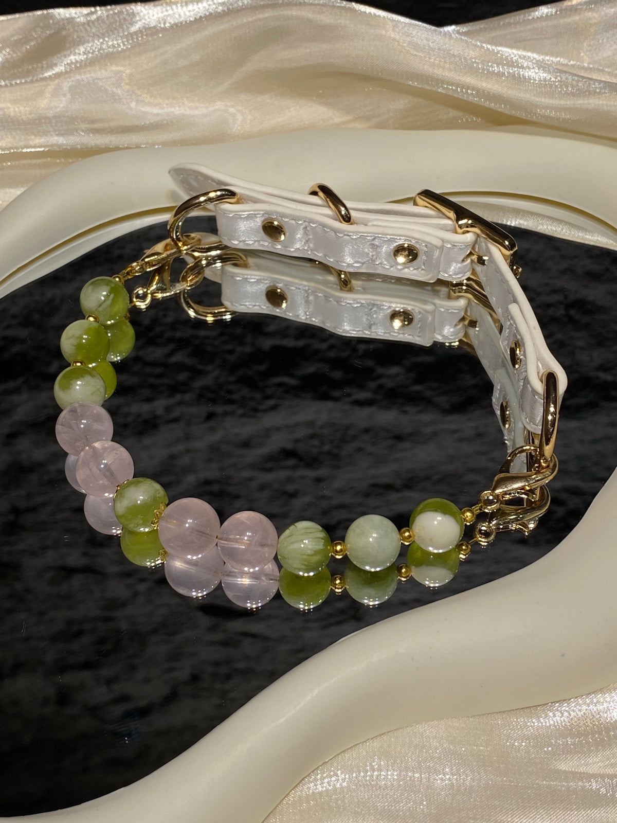White strap and gold-tone hardware detail on Green Mist & Peach crystal pet collar