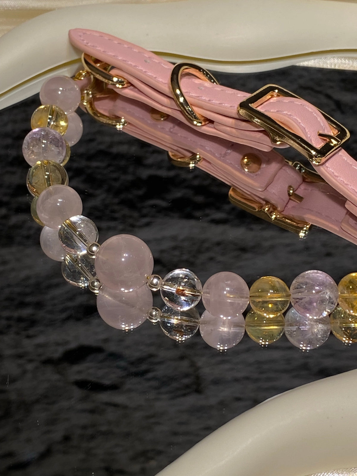 Pink strap and gold-tone buckle detail on Peach Glow mixed-bead crystal pet collar