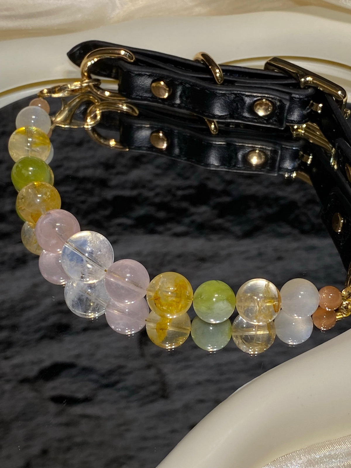 Black strap, gold-tone buckle and hardware detail on Lime Jelly crystal pet collar