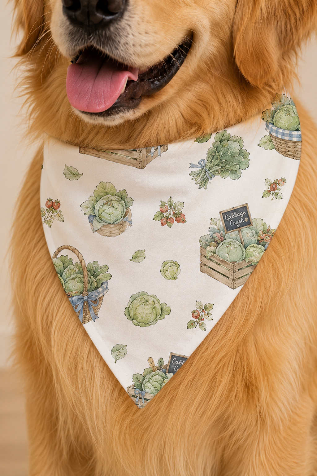 A golden retriever dog wearing a cream-colored bandana with a vintage-style print of cabbages, baskets, and crates, set against a warm beige background.