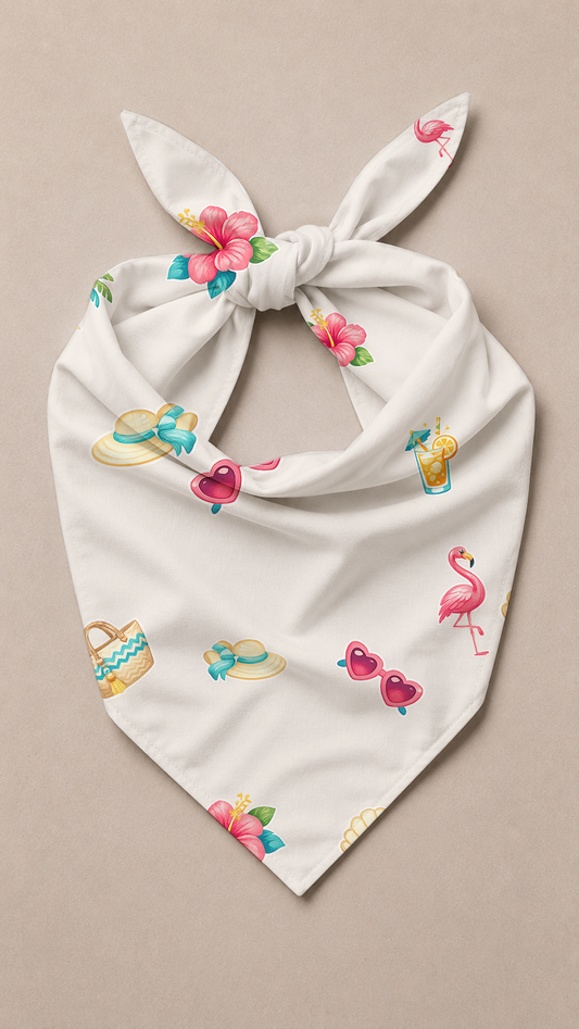 An off-white tie-front bandana or scarf featuring a colorful tropical print with pink flamingos, hibiscus flowers, sunglasses, and beach accessories, displayed flat on a neutral beige background.