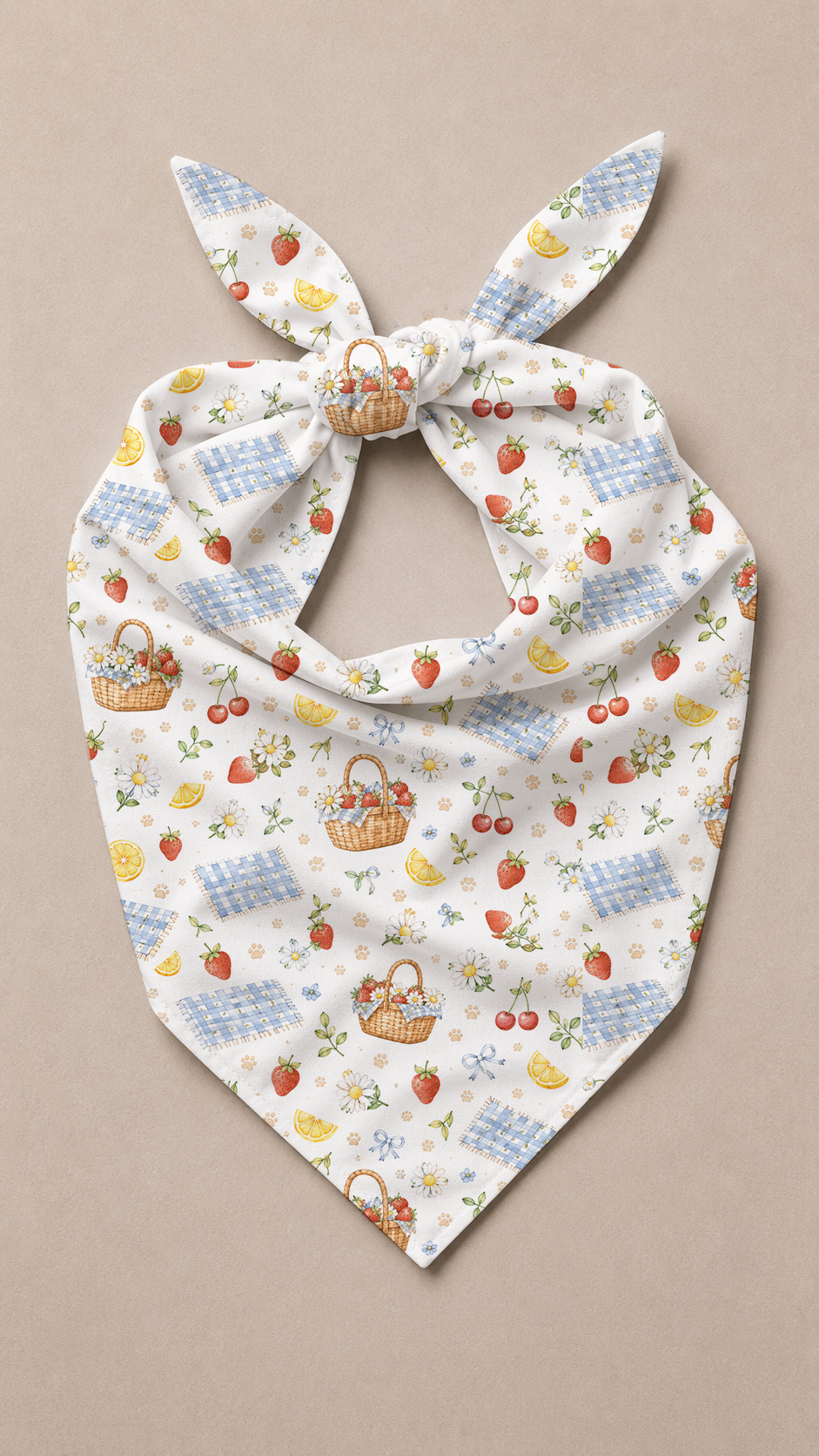 Flat lay view of a Picnic dog bandana with tiny picnic baskets, strawberries, cherries, and lemon slices.