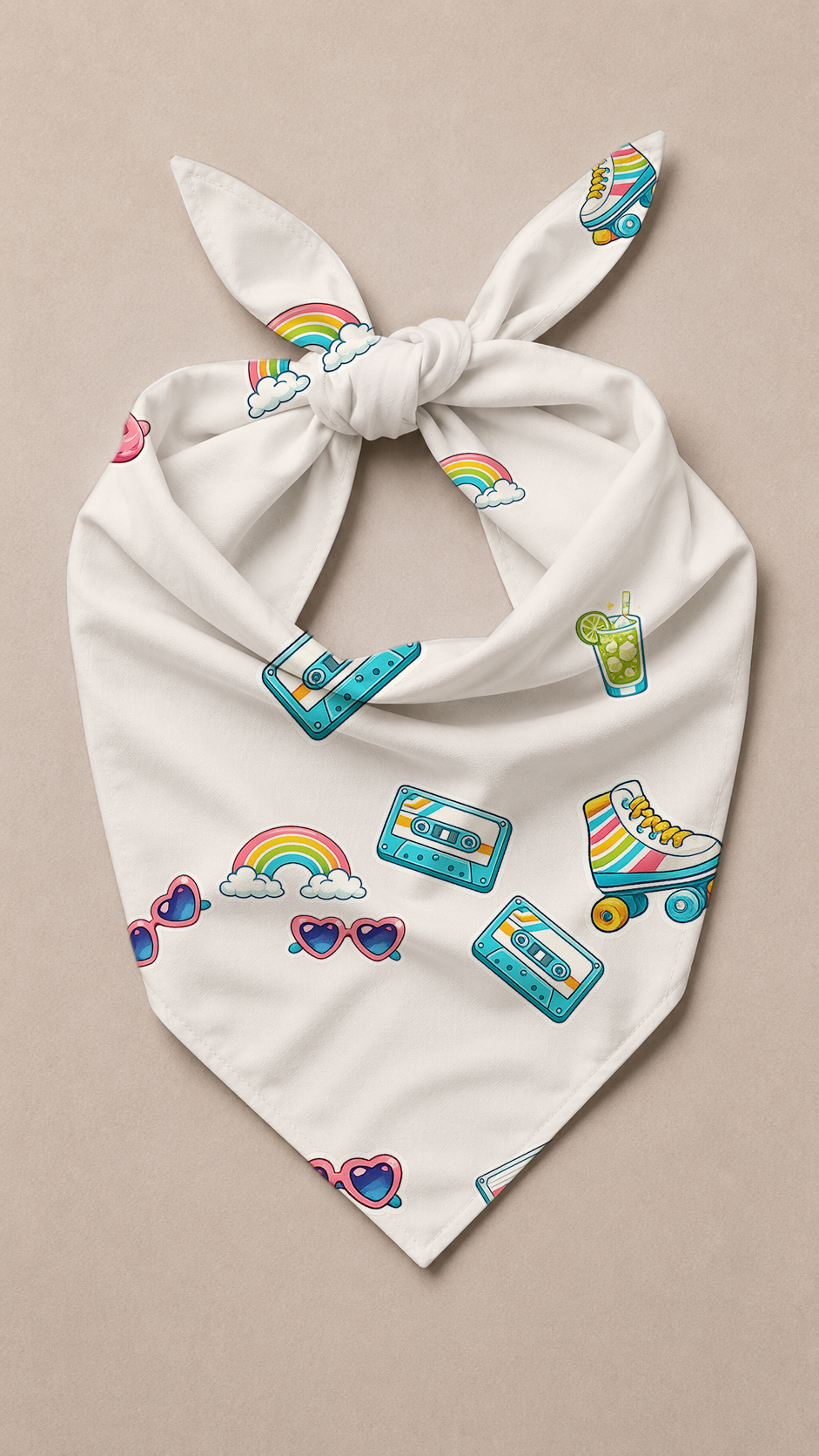 A white tie-front bandana or scarf featuring a colorful retro pattern of rainbows, cassette tapes, roller skate wheels, heart-shaped sunglasses, and a drink, displayed flat on a neutral beige background.
