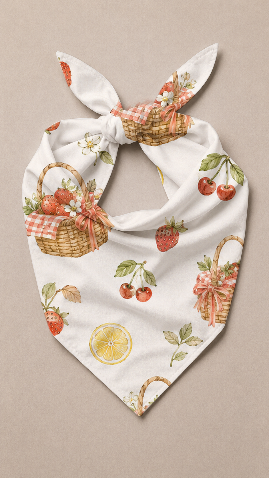 A white bandana-style pet scarf with a knotted top, featuring a vintage-style print of strawberry baskets, cherries, leaves, and a lemon slice on a neutral beige background.