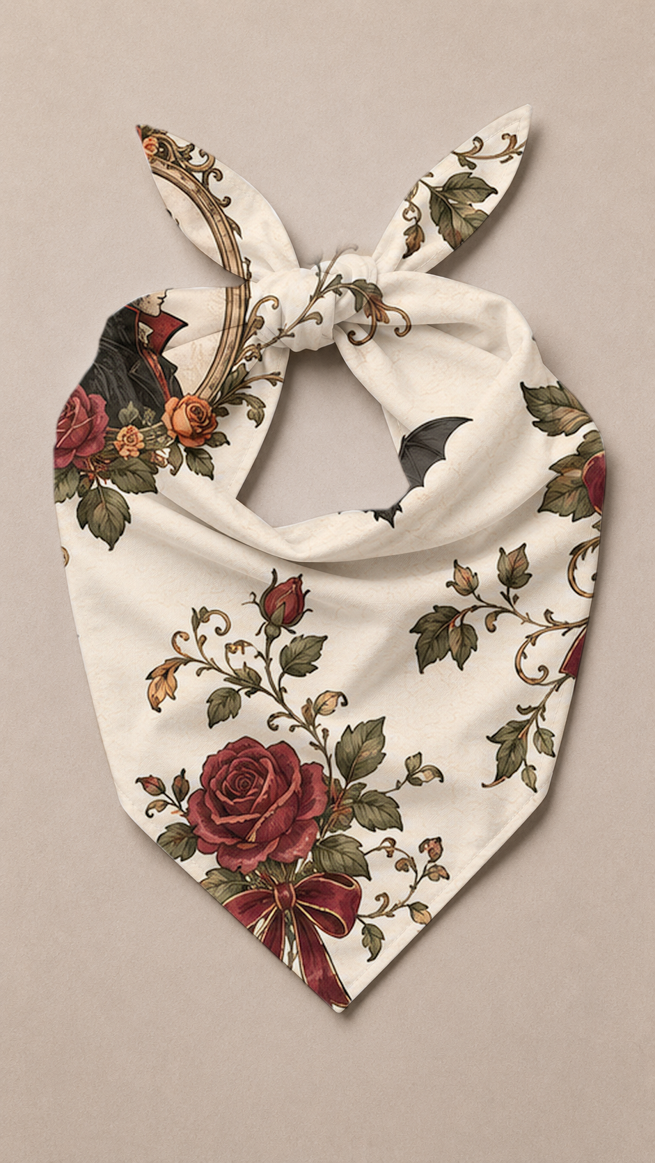 A cream-colored pet bandana featuring a vintage-style print of red roses, green leaves, and black birds, tied in a knot at the top against a neutral beige background.